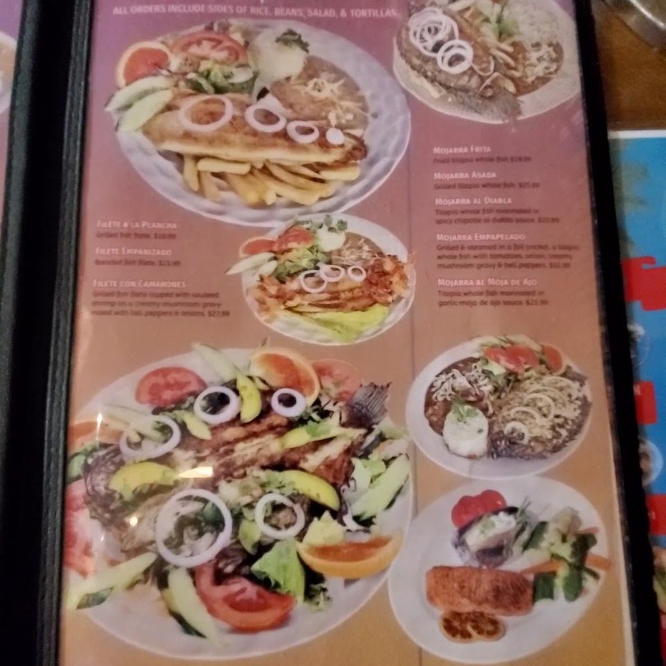 Menu page with seafood and breakfast dishes.